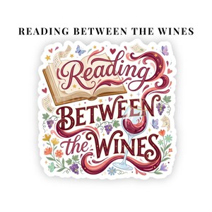 May include: A die-cut sticker featuring an open book and a glass of red wine with the text Reading BETWEEN THE WINES in decorative script. The design includes purple grape clusters, colorful flowers, small butterflies, and red hearts on a white background.