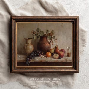 May include: A framed still life painting featuring a copper pitcher, a vase, and various fruits, including grapes, apples, and pears. The artwork has a vintage aesthetic with a dark wooden frame and the text "PAPERMUSE PUBLISHING" at the bottom.
