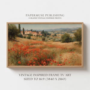 May include: A framed landscape print featuring a field of red poppies in the foreground, with a village and rolling hills in the background. The artwork is in a wooden frame and includes the text "PAPERMUSE PUBLISHING" and "VINTAGE INSPIRED FRAME TV ART".