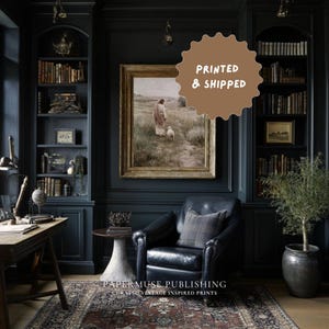 May include: A dark, moody room with built-in bookshelves, a leather armchair, and a framed vintage print. The print depicts a figure with a lamb in a field. The text "PRINTED & SHIPPED" is on a brown circular sticker. The text "PAPERMUSE PUBLISHING CURATED VINTAGE INSPIRED PRINTS" is at the bottom.