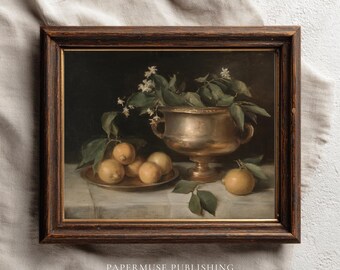 May include: A framed vintage still life painting featuring lemons, a brass bowl, and a small plate. The lemons are yellow, and the bowl and plate are gold. Green leaves and white flowers add detail to the composition.