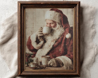 May include: A framed vintage print featuring Santa Claus drinking from a mug. Santa is wearing a red suit and a white beard. The print has a rustic, aged appearance. The text "PAPERMUSE PUBLISHING" is visible at the bottom of the frame.