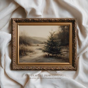 May include: A framed vintage landscape painting depicts a winter scene with a snow-covered path leading to a fir tree. The artwork is in a gold ornate frame. The painting has a muted color palette of browns, greens, and whites. The text "PAPERMUSE PUBLISHING" is at the bottom.
