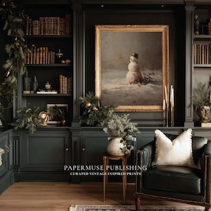 May include: A dark green library interior with built-in bookshelves, a framed painting of a snowman, and a leather armchair. The room is decorated with greenery and candles, creating a cozy, vintage aesthetic. The text "PAPERMUSE PUBLISHING" is visible.