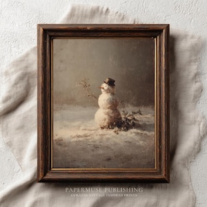 May include: A framed vintage print depicting a snowman in a snowy scene. The snowman is wearing a small top hat and has a carrot nose. The artwork is in a dark wooden frame and features the text "PAPERMUSE PUBLISHING" at the bottom.