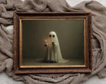 May include: A framed vintage print featuring a ghost holding a lit candle and a small box. The ghost is draped in a white sheet with eye holes. The frame is dark brown with gold trim. The text "PAPERMUSE PUBLISHING" is at the bottom.