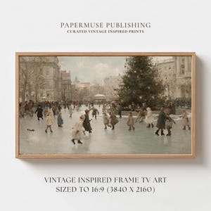 May include: A framed vintage-inspired print depicts a winter scene with people ice skating in a city square. The artwork features a large Christmas tree and buildings in the background. The frame is made of light-colored wood. The text "PAPERMUSE PUBLISHING" and "VINTAGE INSPIRED FRAME TV ART" are visible.