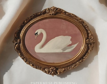 May include: An oval framed print featuring a white swan on a pink background. The swan has a black beak and is reflected in the water. The ornate gold frame has decorative detailing. The text "PAPERMUSE PUBLISHING" and "CURATED VINTAGE INSPIRED PRINTS" are at the bottom.