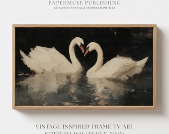 May include: A framed vintage-inspired print features two white swans with their necks forming a heart shape. The artwork is set against a dark background, with the text "PAPERMUSE PUBLISHING" and "VINTAGE INSPIRED FRAME TV ART" visible.