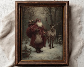 May include: A framed vintage print depicting Santa Claus in a red coat, carrying a sack and lantern, accompanied by a reindeer in a snowy forest. The print is set within a dark brown wooden frame. The text "PAPERMUSE PUBLISHING" and "CURATED VINTAGE INSPIRED PRINTS" is at the bottom.