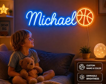 May include: A custom neon wall sign featuring the name Michael in blue cursive script lettering next to an orange basketball graphic. The sign is mounted on a wall and emits a bright glow, with a power cord extending downward from the basketball.