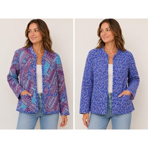 May include: A reversible quilted jacket featuring a blue and purple patchwork pattern on one side and a small-scale blue floral print on the other. The jacket has a collarless open front, long sleeves, and two front patch pockets on both sides.