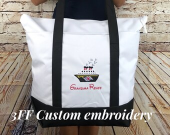 May include: White tote bag with black straps and a black bottom. The bag has an embroidered design of a cruise ship with Mickey Mouse characters and the text "Grandma Renee".