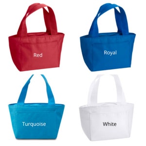 May include: Four insulated lunch bags in different colors: red, royal blue, turquoise, and white. Each bag has a single handle and a small pocket on the front. The bags are labeled with their respective colors.