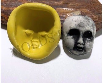 Molde de silicona con cara espeluznante de bebé