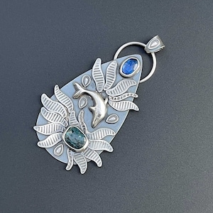 Silver dolphin pendant with blue and teal kyanite