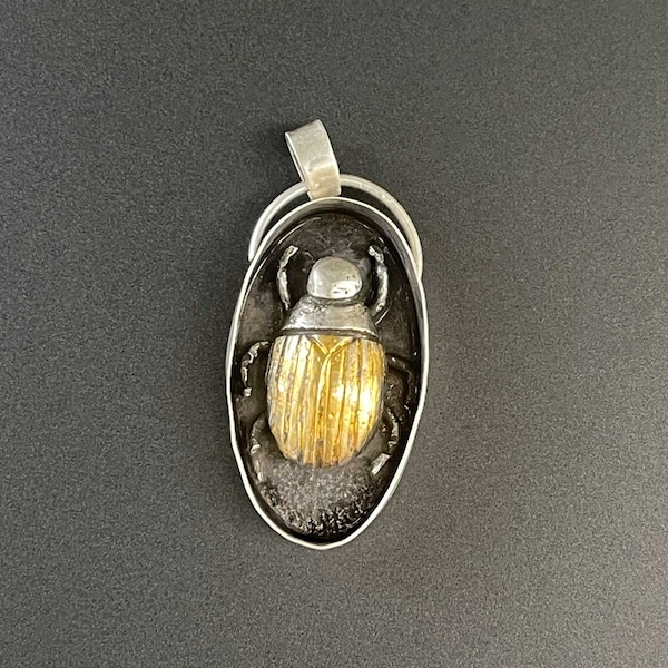 Hand forged golden beetle pendant