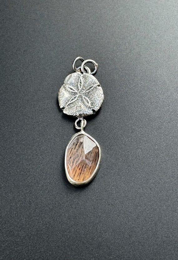 Silver sand dollar pendant with African moonstone