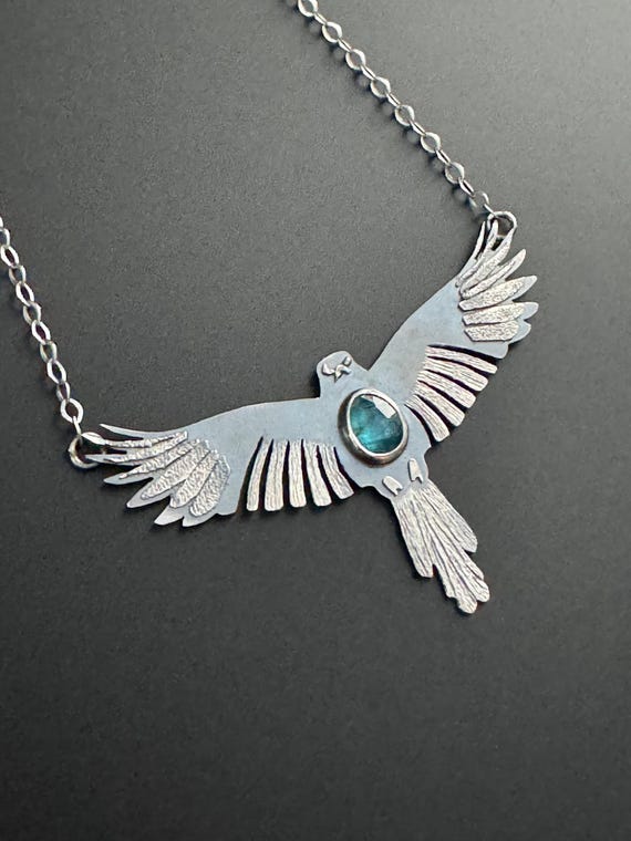 Soaring bird necklace with blue kyanite