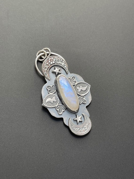 Moonstone pendant with moons and stars