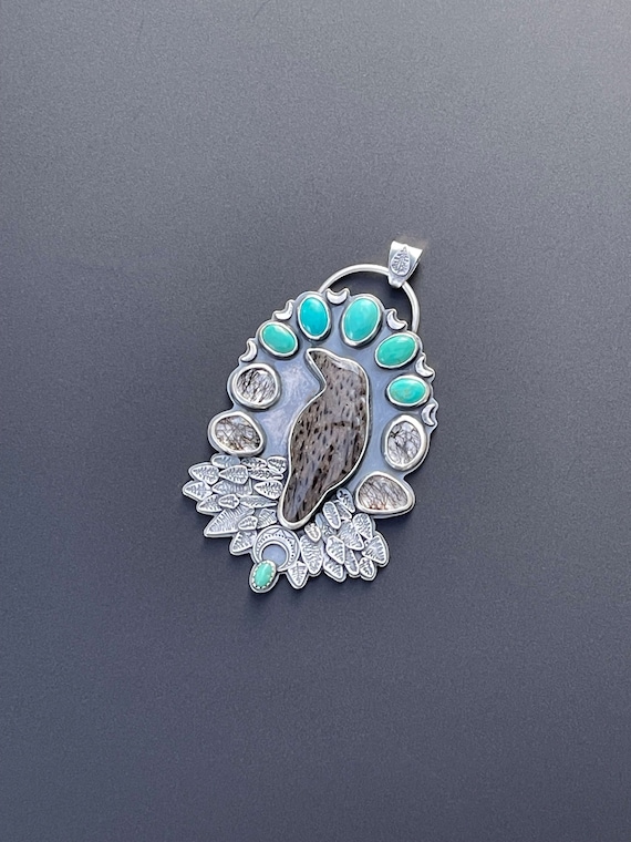 Raven pendant with turquoise and rutilated quartz