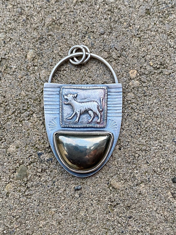 Tiger and pyrite pendant