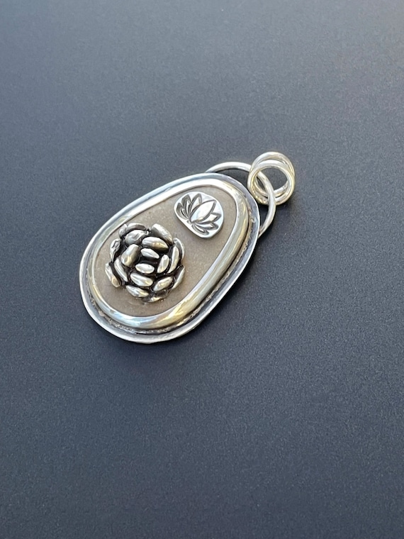 Beach stone pendant with succulent and lotus flower