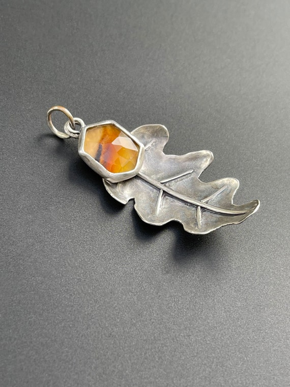 Hand forged oak leaf pendant with montana agate