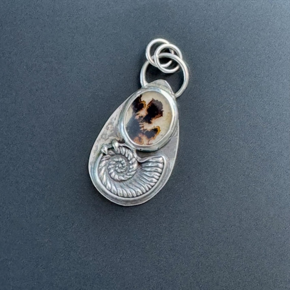 Dendritic agate pendant with silver nautilus