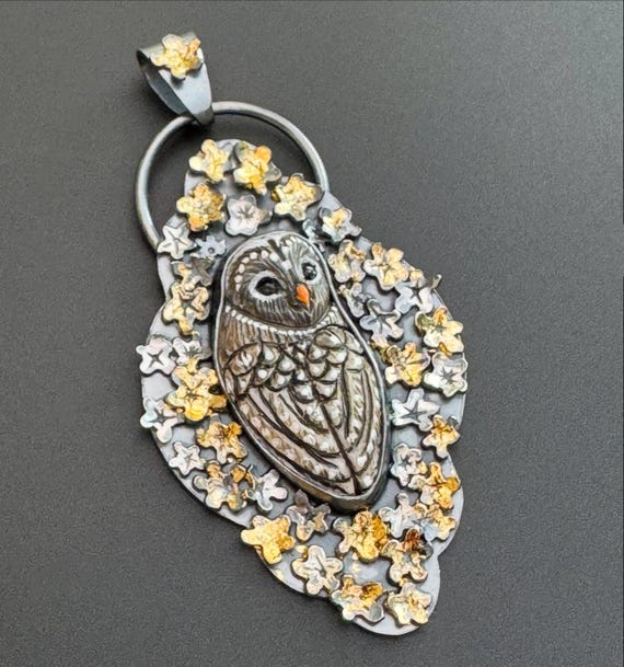 Gray Owl amulet with gold and silver blossoms