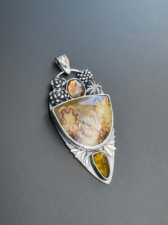 Floral Ammonite pendant with tourmaline smokey quartz