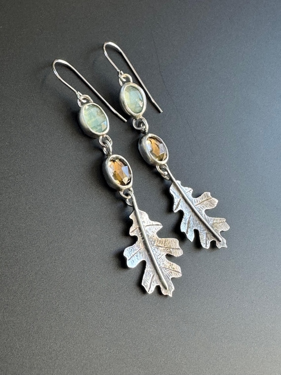 Hand fabricated Oak Leaf earrings with aquamarine and smokey quartz