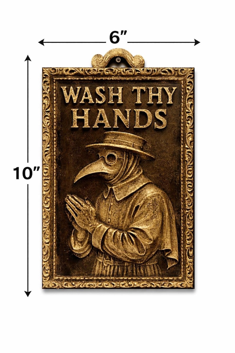 May include: A rectangular, gold-colored wall plaque, 6 inches wide and 10 inches tall, featuring a relief of a plague doctor. The plaque has the words "WASH THY HANDS" at the top. The doctor is wearing a hat and a long-beaked mask, with hands clasped in prayer.