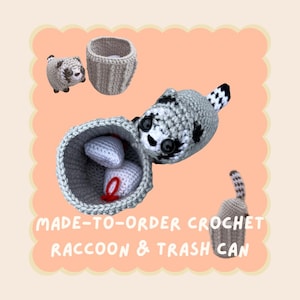 May include: A crocheted raccoon and trash can set. The raccoon is grey and white with black markings, and the trash can is grey. The set includes a small raccoon, a trash can, and two white crocheted items with red accents. The text reads "MADE-TO-ORDER CROCHET RACCOON & TRASH CAN."