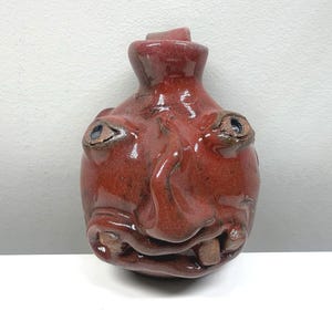 May include: A rustic wooden sign with the text "Welcome to our home" in white lettering. The sign features a distressed finish and a simple, inviting design, perfect for a front porch or entryway.