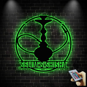 May include: A black metal hookah silhouette with green neon lighting, set against a dark brick wall. The design is framed by a circle and includes the text "SELIM'S SHISHA". A remote control with color options is visible.