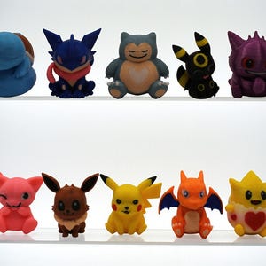 Collectible Chibi Miniatures | Snorlax | Gengar | Charizard | Pikachu | Mew | Eevee | Umbreon | Togepi | Greninja | Squirtle