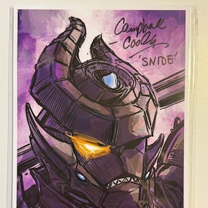 May include: A black and white illustration of a robot with a purple and yellow color scheme. The robot has a large head with a single eye and a sharp, pointed jaw. The signature "Campbell Cooley 'SNIDE'" is visible in the top right corner.