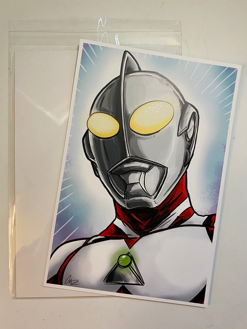 May include: A black and white illustration of a superhero with a red and white suit. The superhero has a large, silver head with a green gem on the chest. The background is a blue and white gradient.