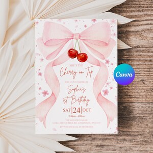 May include: A pink watercolor birthday invitation with a bow and cherries. The text reads "She's the Cherry on Top" and announces Sophia's 1st Birthday on October 24th. The Canva logo is visible.