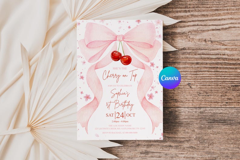 May include: A pink watercolor birthday invitation with a bow and cherries. The text reads "She's the Cherry on Top" and announces Sophia's 1st Birthday on October 24th. The Canva logo is visible.