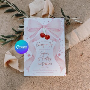 May include: A pink invitation card with a bow and cherry design. The text reads "She's the Cherry on Top" and announces Sophia's 1st Birthday on Saturday, October 24th. The card is decorated with pink floral accents.