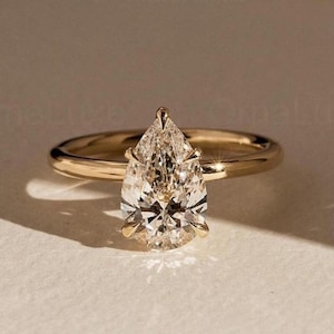 2 CT Pear Cut Moissanite Engagement Ring, Hidden Halo Ring, 14K Yellow Gold Diamond Ring, Anniversary Gift, Ring For Women, Wedding Ring.
