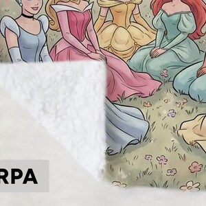 May include: Sherpa blanket featuring a colorful illustration of several cartoon princesses in a grassy field. The princesses are wearing gowns in various colors, including blue, pink, and yellow. The blanket has a soft, white sherpa backing.