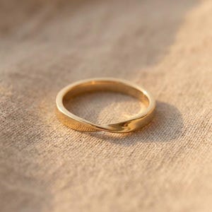 May include: A set of three ceramic vases in varying heights and shapes. The vases are glazed in a matte white finish, offering a minimalist aesthetic. The tallest vase is approximately 10 inches high.