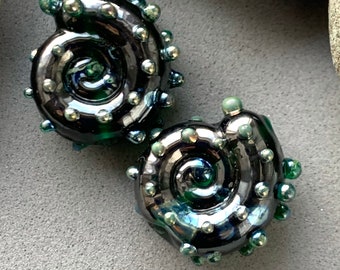 Deep green shiny metallic ammonite lampwork bead pair