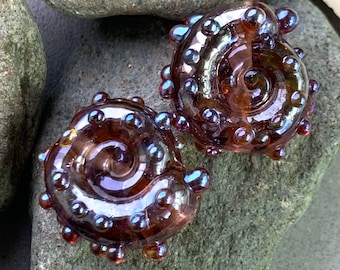 Deep green shiny metallic ammonite lampwork bead pair