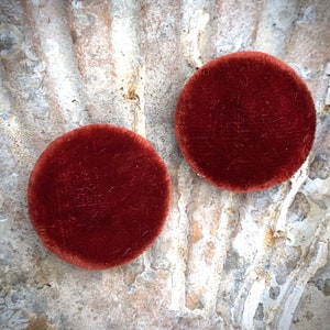 Pair of amber silk velvet buttons