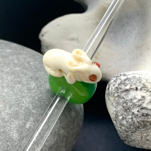 White/cream lampwork glass albino rabbit big hole bead. Lime and green base bead. 5mm bead hole suitable for Pandora, Troll, European charms