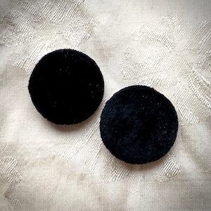 Pair of black silk velvet buttons